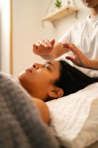 Woman receiving reiki to give her balance and harmony to her body.