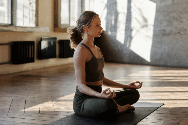 a woman practicing meditation to reduce her stress