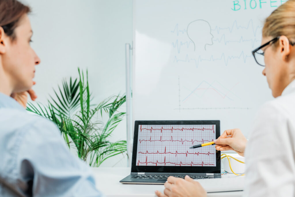 Biofeedback training. Biofeedback practitioner and client in consultation