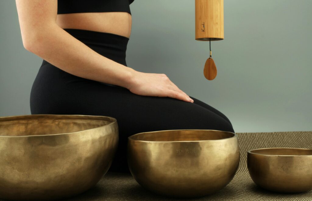 sound bowls and torso of woman