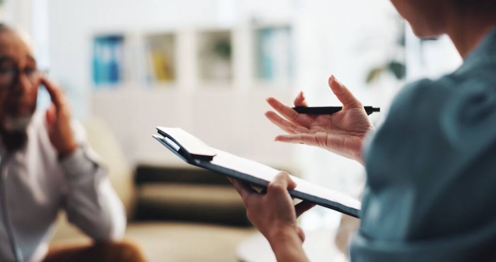 therapist speaks to a client