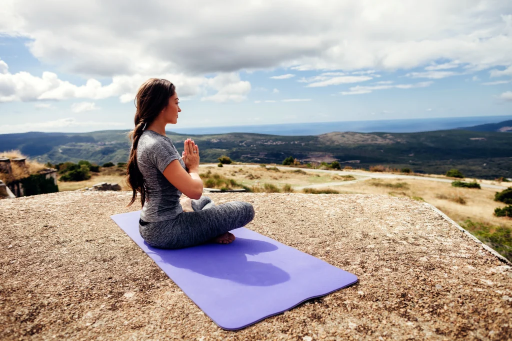 woman meditating in arizona desert during a retreat