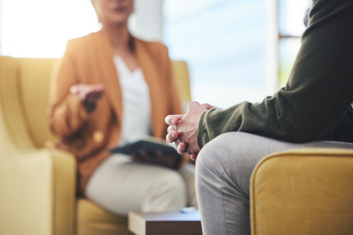 A client talking with a therapist during an individual therapy session