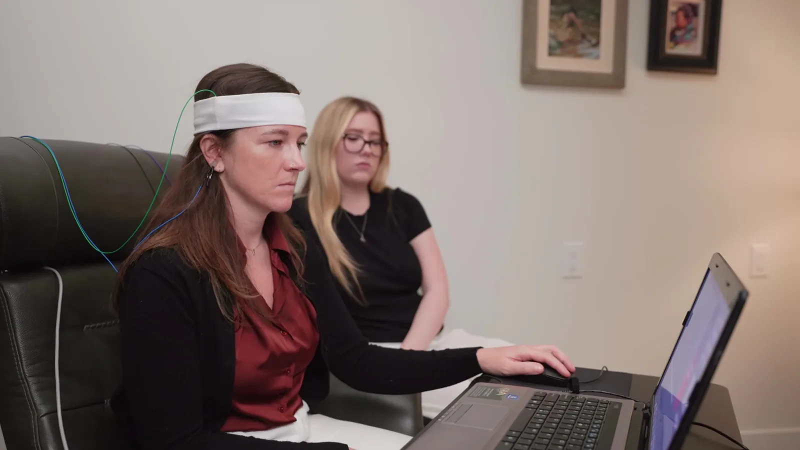 Neurofeedback technician running a training session with a client at Redefine in Scottsdale