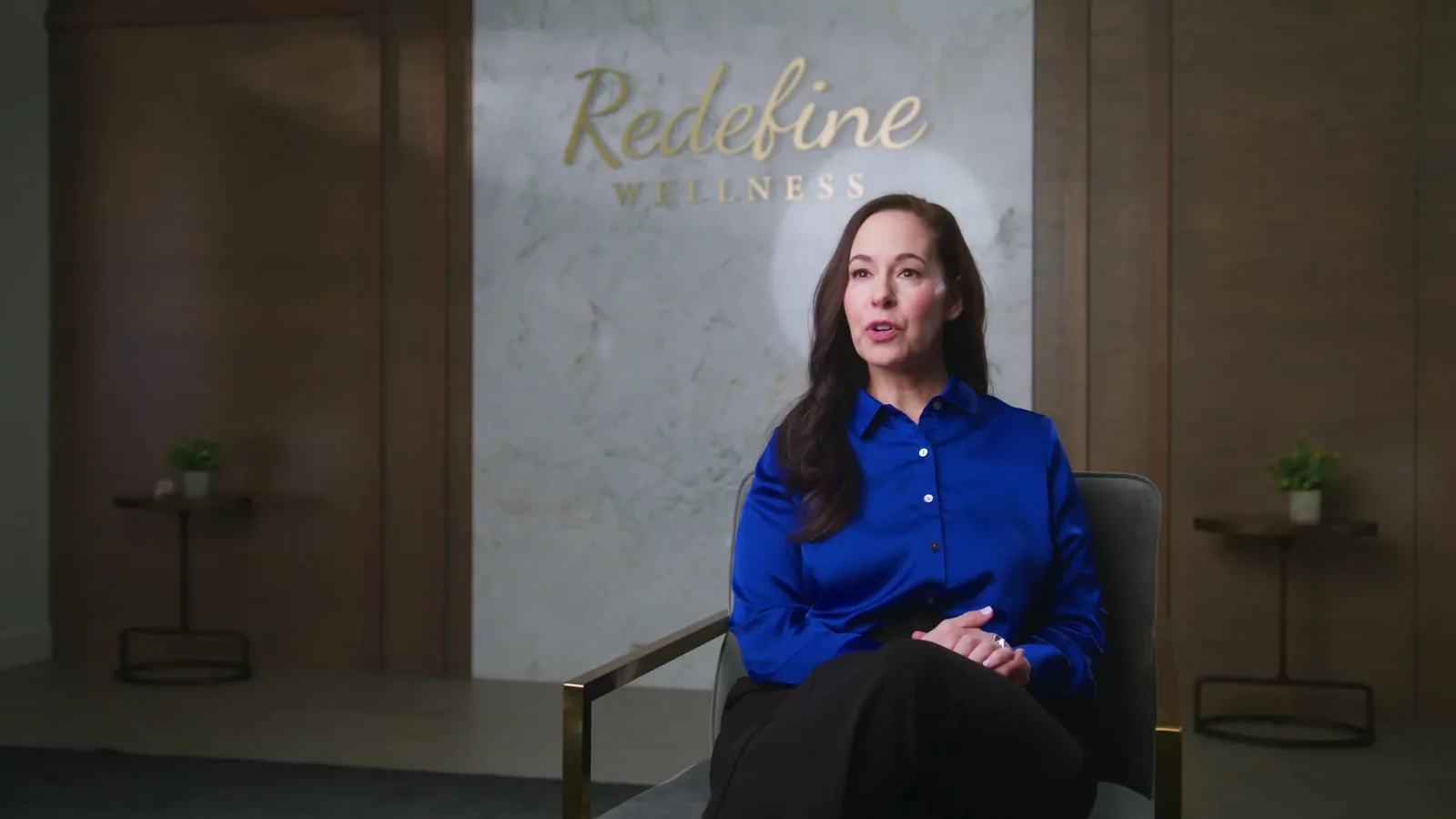 A woman speaking during an interview at Redefine