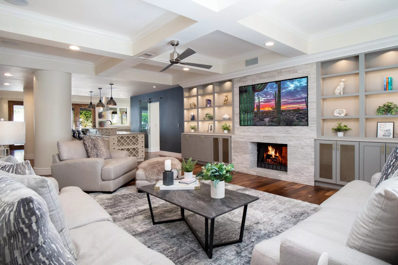 Living room with a fireplace and built-in shelving at Mariposa, a residential location for women